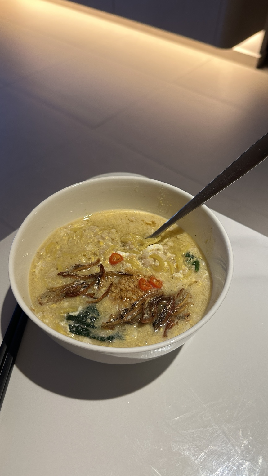 Kelly’s homemade ban mian with egg, spinach, crispy ikan bilis and chilli padi