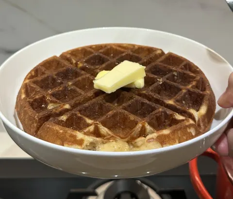 Kelly’s homemade Belgian waffle topped with butter and syrup