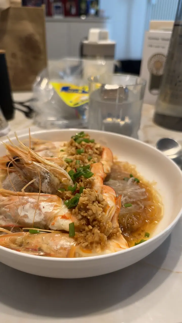 Kelly’s steamed garlic prawns over glass noodles, topped with spring onions