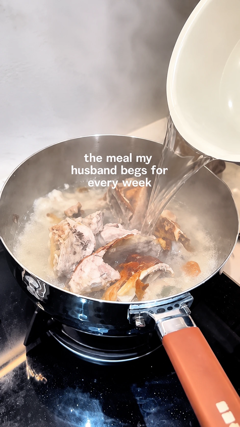 Kelly cooking fish soup at home